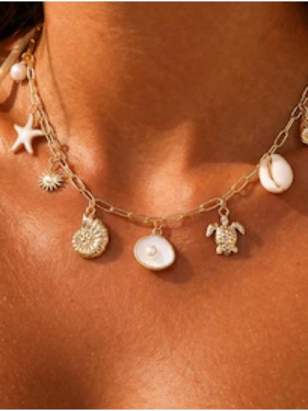 Gold Charm Seashell Necklace with White Pearl Accent